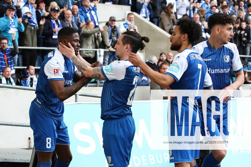 Goal celebration scorer Moritz Broni Kwarteng 1 FC Magdeburg,8 hits to the 1 0 with v l Baris Atik 1 FC Magdeburg,23 ,Herbert Bockhorn 1 FC Magdeburg,7 ,Daniel Elfadli 1 FC Magdeburg,6 2 Football Bundesliga season 2022 2023 1 FC Magdeburg vs Hamburger SV in the MDCC Arena in Magdeburg action,soccer,man,men,Germany