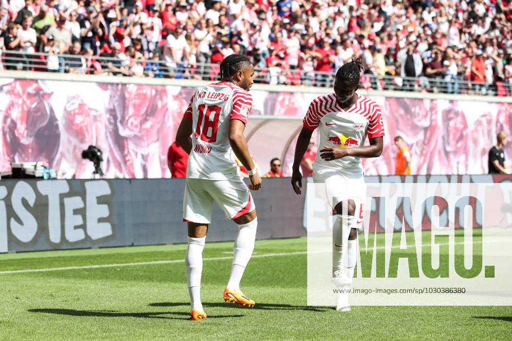 Goal celebration scorer Christopher Nkunku RB Leipzig,18 scores to 2 0 with Amadou Haidara RB Leipzig,8 1 Football Bundesliga season 2022 2023 point game RB Leipzig vs FC Schalke 04 in the Red Bull Arena in Leipzig action,football,Germany,man,men