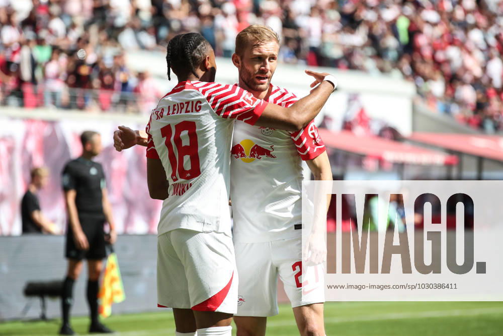 Goal celebration scorer Christopher Nkunku RB Leipzig,18 scores to 2 0 with Konrad Laimer RB Leipzig,27 1 Football Bundesliga season 2022 2023 point game RB Leipzig vs FC Schalke 04 in the Red Bull Arena in Leipzig action,football,Germany,man,men