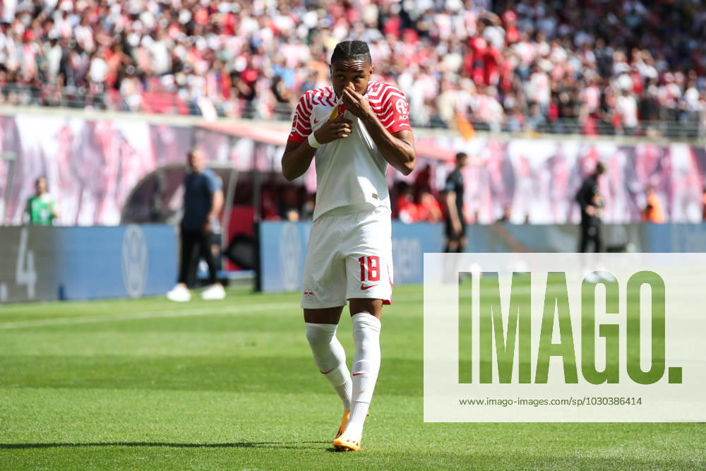Goal celebration scorer Christopher Nkunku RB Leipzig,18 scores 2 0 1 Football Bundesliga season 2022 2023 point game RB Leipzig vs FC Schalke 04 at Red Bull Arena in Leipzig action,football,Germany,man,men
