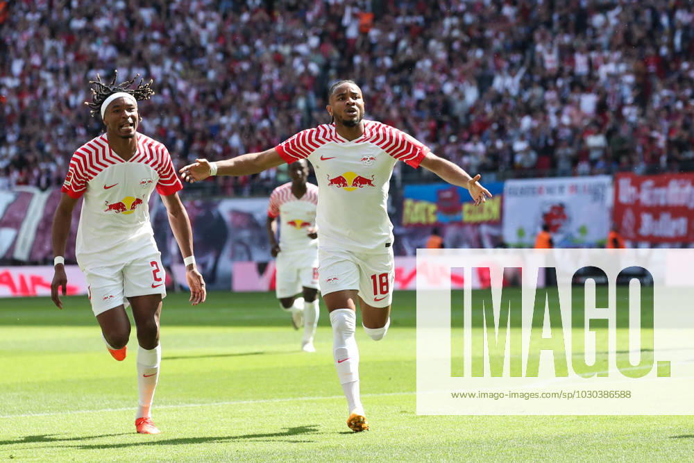 Goal celebration scorer Christopher Nkunku RB Leipzig,18 scores 2 0 1 Football Bundesliga season 2022 2023 point game RB Leipzig vs FC Schalke 04 at Red Bull Arena in Leipzig action,football,Germany,man,men