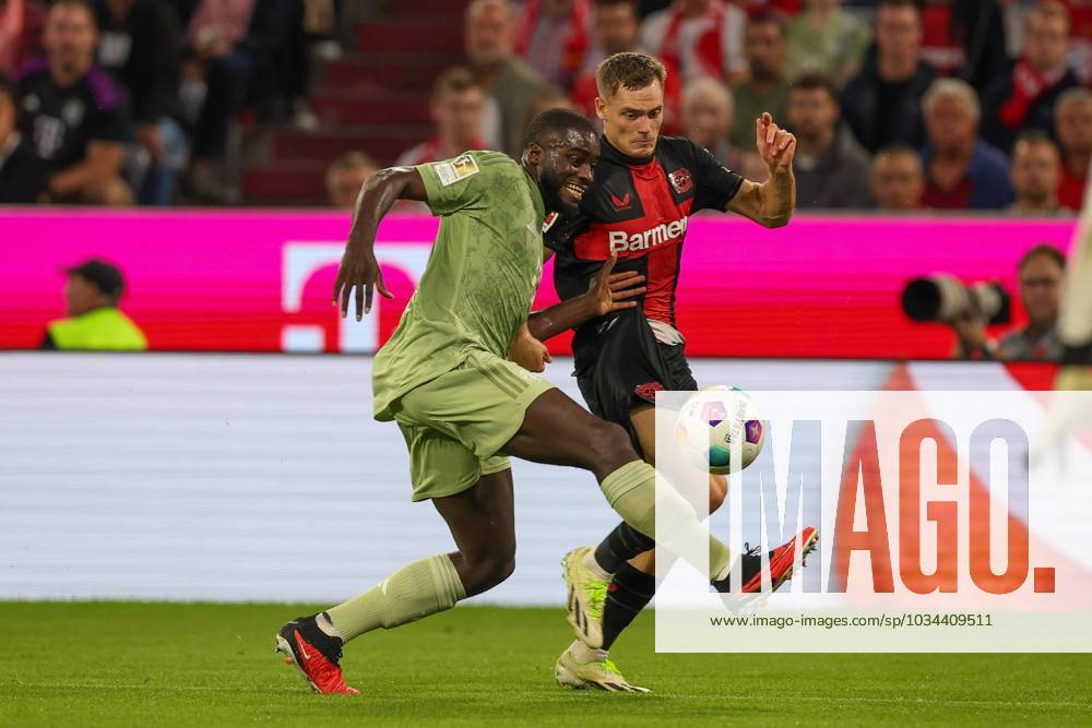 In duel, action, with Dayot Upamecano 2 FC Bayern Muenchen , Florian Wirtz 10 Bayer 04 Leverkusen , FC Bayern Muenchen vs Bayer 04 Leverkusen, football, 1 Bundesliga, 4 Spieltag, 15 09 2023 DFB regulations prohibit any use of photographs as image sequences and or quasi video Muenchen Bayern Germany