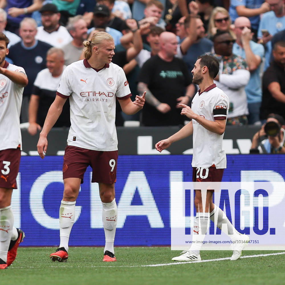 Erling Haland of Manchester City scores to make it 1-3 and celebrates with Bernardo Silva of Manchester City during the Premier League match between West Ham United and Manchester City at the London Stadium, Queen Elizabeth Olympic Park , London, England on 16 September 2023.