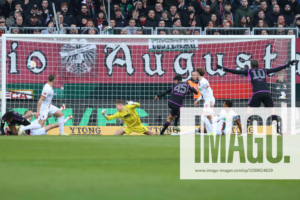 Aleksandar Pavlovic FC Bayern Munich scores to 0 1 against Finn Dahmen Goalkeeper FC Augsburg 1 FC Augsburg vs FC Bayern Munich, Matchday 19 DFL REGULATIONS PROHIBIT ANY USE OF PHOTOGRAPHS AS IMAGE SEQUENCES AND OR QUASI VIDEO