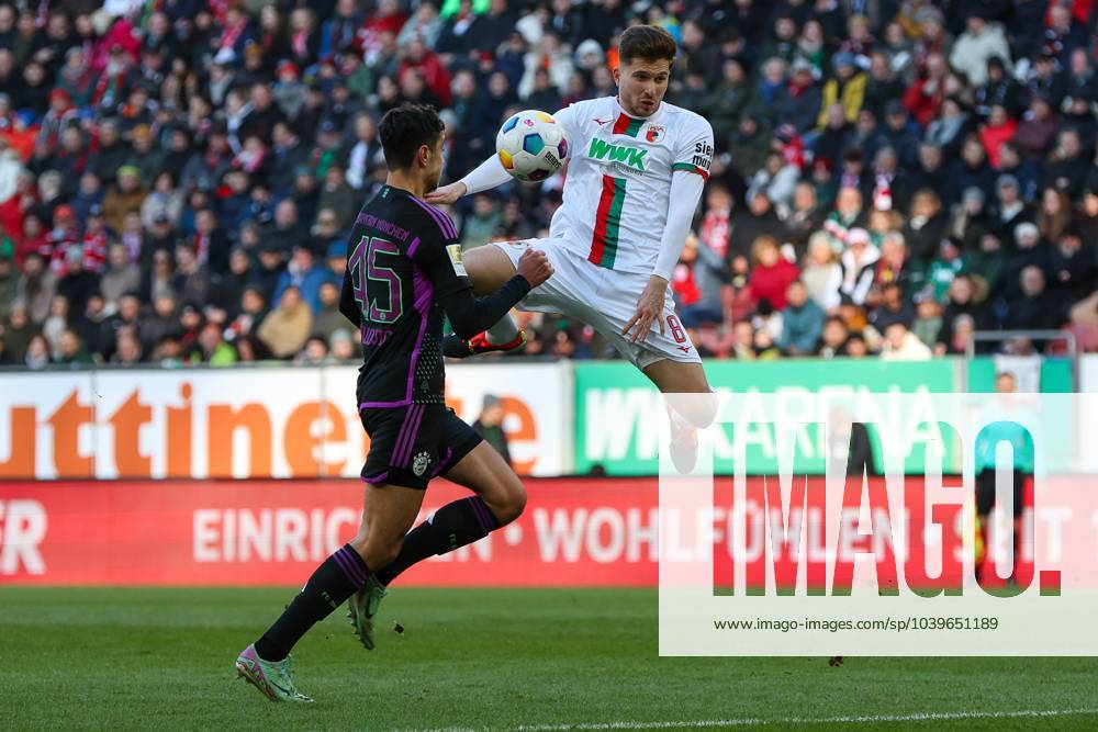 In duel, action, with Alexandar Pavlovic 45 FC Bayern Muenchen , Elvis Rexhbecaj 8 FC Augsburg , FC Augsburg vs FC Bayern Muenchen, Soccer, 1 Bundesliga, 19 Matchday, 27 01 2024 DFB regulations prohibit any use of photographs as image sequences and or quasi video Augsburg Bayern Germany