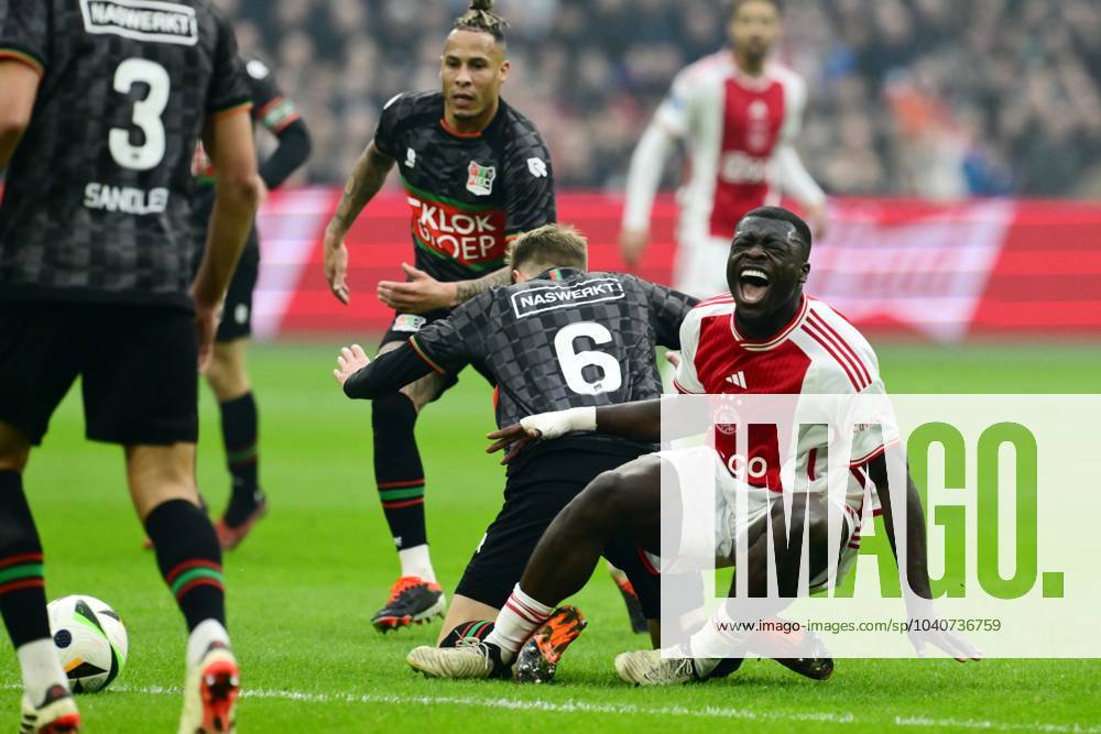 AMSTERDAM - (l-r) Tjaronn Chery of NEC Nijmegen, Mees Hoedemakers of NEC Nijmegen, Brian Brobbey of Ajax during the Dutch Eredivisie match between Ajax Amsterdam and NEC Nijmegen at the Johan Cruijff ArenA on February 18, 2024 in Amsterdam, Netherlands. ANP OLAF KRAAK Dutch Eredivisie 2023 2024 ANPxSportx IVx 491428131 originalFilename: 491428131