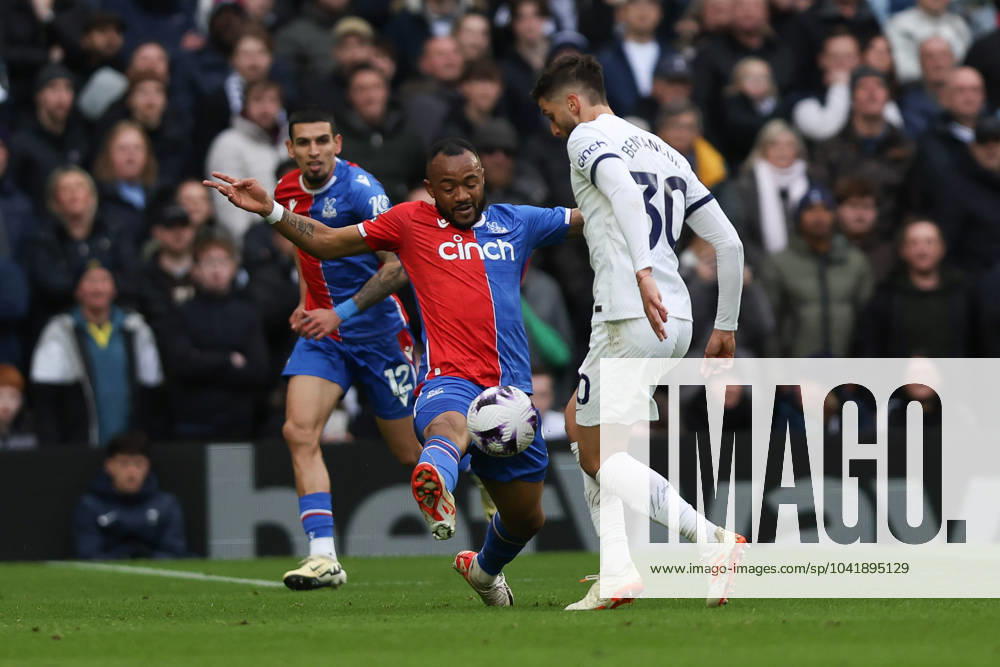 Rodrigo Bentancur of Tottenham Hotspur is challenged by Jordan Ayew of Crystal Palace during the Premier League match between Tottenham Hotspur and Crystal Palace at Tottenham Hotspur Stadium, London, England on 2 March 2024.
