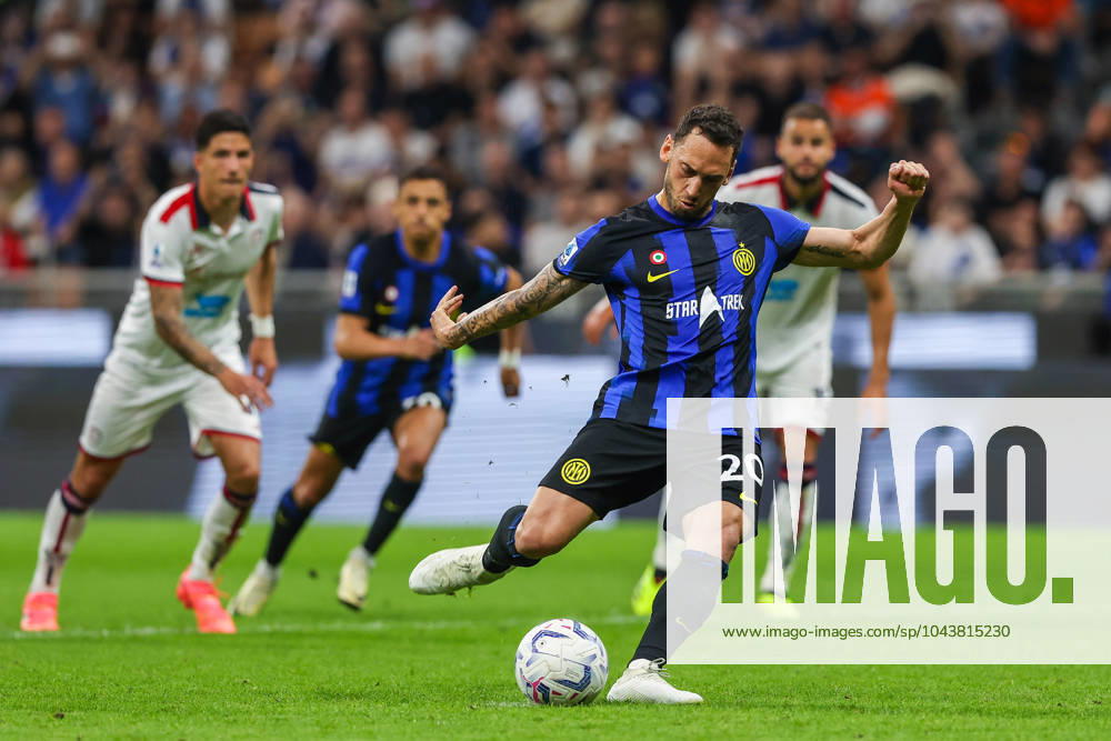 Hakan Calhanoglu of FC Internazionale scores a penalty during Serie A 2023 24 football match between FC Internazionale and Cagliari Calcio at Giuseppe Meazza Stadium, Milan, Italy on April 14, 2024 - Milan Stadio Giuseppe Meazza Milan Italy