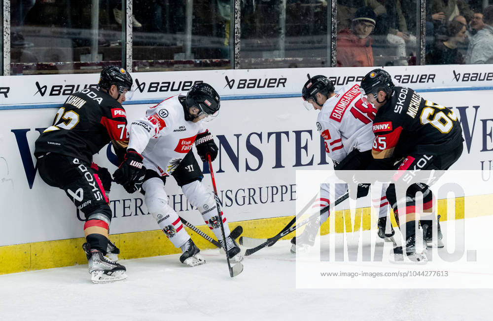 Fight for the puck duel between Dominik Kahun Team Germany, 72 and Marc Michaelis Team Germany, 65 with Kilian Zuendel Team Austria, 14 and Benjamin Baumgartner Team Austria, 18 GER, Germany vs. Austria, ice hockey, test match, World Championship preparation 2024, 25 04 2024 GER, Germany vs. Austria, ice hockey, test match, World Championship preparation 2024, 25 04 2024 Garmisch Partenkirchen