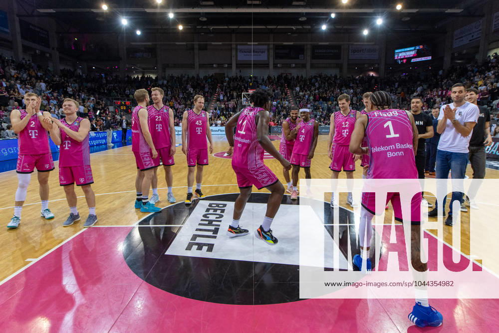 Telekom Baskets Bonn team celebrates victory against Rostock Seawolves Thomas Kennedy Telekom Baskets Bonn, 54 ,Florian Koch Telekom Baskets Bonn, 12 ,Glynn Watson Telekom Baskets Bonn, 04 ,Savion Flagg Telekom Baskets Bonn, 01 ,Brian Fobbs Telekom Baskets Bonn, 11 ,Christian Sengfelder Telekom Baskets Bonn, 43 ,Lars Thiemann Telekom Baskets Bonn, 21 ,Till Pape Telekom Baskets Bonn, 19 ,Harald Frey Telekom Baskets Bonn, 05 ,Tyreese Blunt Telekom Baskets Bonn, 0 Telekom Baskets Bonn vs Rostock Seawolves, Basketball, easy Credit BBL, 30 Matchday, 2023 24, 27 04 2024 Telekom Baskets Bonn vs Rostock Seawolves, Basketball, easy Credit BBL, 30 Matchday, 2023 24, 27 04 2024 Bonn