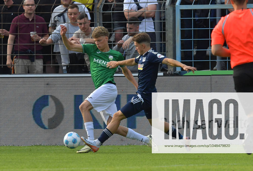 GER, Soccer, Regionalliga West, Season 2024 2025, Matchday 01, Ohlendorf Stadion im Heidewald, Gütersloh FC Gütersloh MSV Duisburg 0 1 Henri Bollmann FC Gütersloh, left against Patrick Sussek MSV Duisburg , action, duel, duel