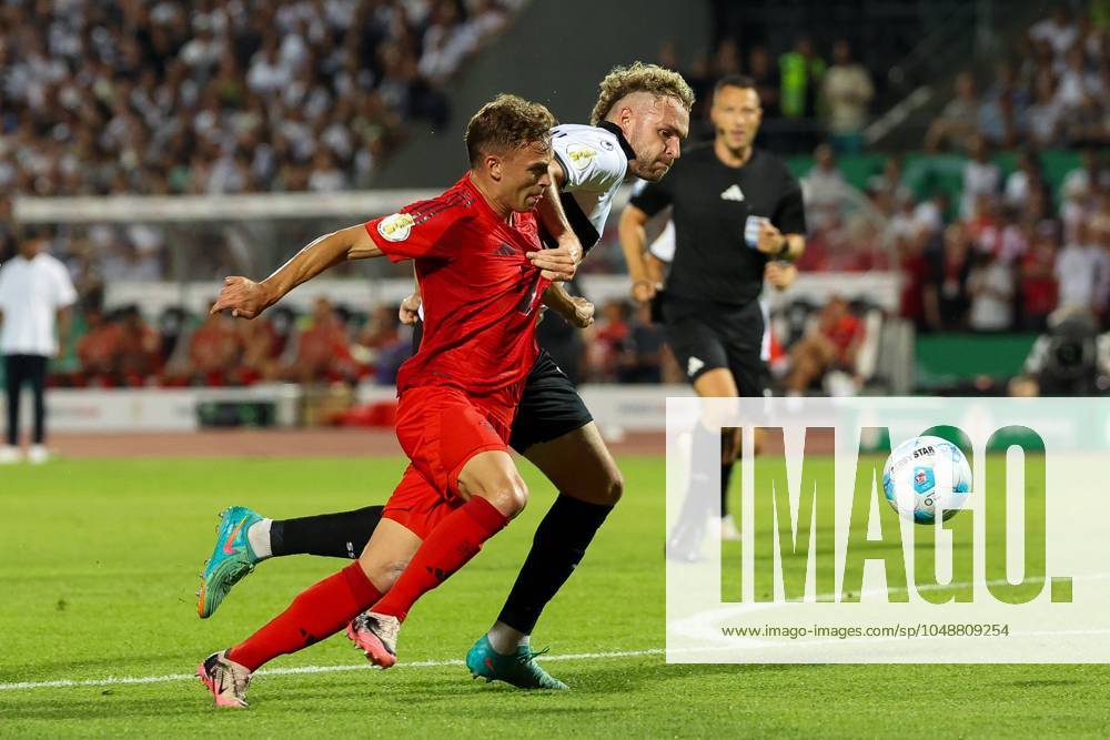 In duel, action, with Joshua Kimmich 6 FC Bayern Muenchen , Philipp Strompf 32 SSV Ulm 1846 , SSV Ulm 1846 vs FC Bayern Muenchen, Football, DFB Pokal, 1 Runde, 16 08 2024 DFB regulations prohibit any use of photographs as image sequences and or quasi video Ulm Baden Wuerttemberg Germany
