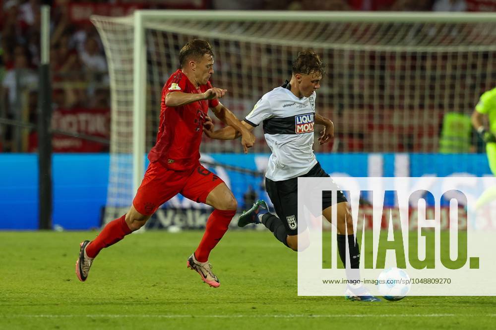 In duel, action, with Joshua Kimmich 6 FC Bayern Muenchen , Maurice Krattenmacher 30 SSV Ulm 1846 , SSV Ulm 1846 vs FC Bayern Muenchen, Football, DFB Pokal, 1 Runde, 16 08 2024 DFB regulations prohibit any use of photographs as image sequences and or quasi video Ulm Baden Wuerttemberg Germany
