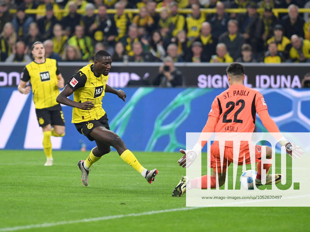 Serhou Guirassy Borussia Dortmund and goalkeeper Nikola Vasilj FC St Pauli battle for the ball during the Bundesliga match between Borussia Dortmund and FC St Pauli 1910, SIGNAL IDUNA PARK on October 18, 2024 in Dortmund, Germany, Germany Photo by Ralf Treese DeFodi Images Serhou Guirassy Borussia Dortmund and goalkeeper Nikola Vasilj FC St Pauli battle for the ball during the Bundesliga match between Borussia Dortmund and FC St Pauli 1910 at Signal Iduna Park on October 18, 2024 in Dortmund, Germany Photo by Ralf Treese DeFodi Images DFL regulations prohibit any use of photographs as image sequences and or quasi video not used in POL SRB CRO FRA GBR NED ITA USA Defodi 521 BVBSTP20241018 011 Defodi-521 not used in POL SRB CRO FRA GBR NED ITA USA DFL regulations prohibit any use of photographs as image sequences and or quasi-video.