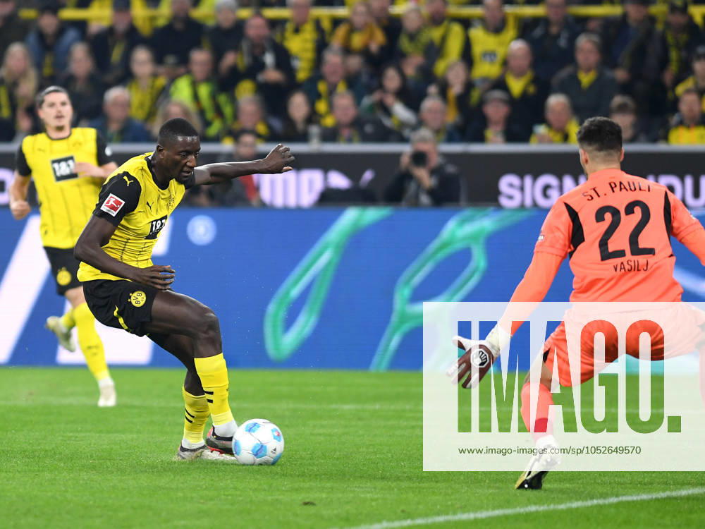 Serhou Guirassy Borussia Dortmund and goalkeeper Nikola Vasilj FC St Pauli battle for the ball during the Bundesliga match between Borussia Dortmund and FC St Pauli 1910, SIGNAL IDUNA PARK on October 18, 2024 in Dortmund, Germany, Germany Photo by Ralf Treese DeFodi Images Serhou Guirassy Borussia Dortmund and goalkeeper Nikola Vasilj FC St Pauli battle for the ball during the Bundesliga match between Borussia Dortmund and FC St Pauli 1910 at Signal Iduna Park on October 18, 2024 in Dortmund, Germany Photo by Ralf Treese DeFodi Images DFL regulations prohibit any use of photographs as image sequences and or quasi video not used in POL SRB CRO FRA GBR NED ITA USA Defodi 521 BVBSTP20241018 059 Defodi-521 not used in POL SRB CRO FRA GBR NED ITA USA DFL regulations prohibit any use of photographs as image sequences and or quasi-video.