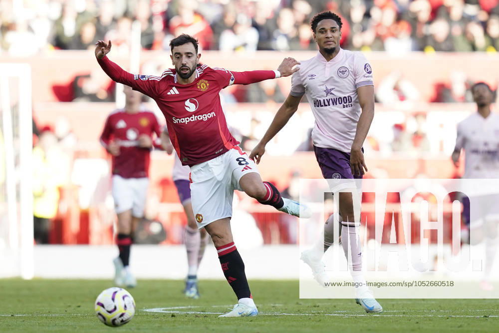 Manchester, England, 19th October 2024. Bruno Fernandes of Manchester United, ManU and Kevin Schade of Brentford challenge for the ball during the Premier League match at Old Trafford, Manchester. Picture credit should read: Andrew Yates Sportimage . SPI-3399-0038