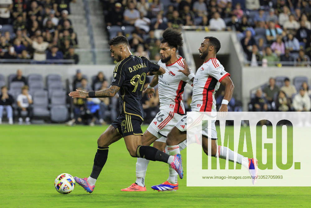 Denis Bouanga 99 of the Los Angeles Football Club is defended by Rodrigues 26 and Carlos Akapo 29 of the San Jose Earthquakes during their regular season MLS, Fussball Herren, USA match on Saturday October 19, 2024 at the BMO Stadium in Los Angeles, California. LAFC defeats Earthquakes, 3-1. JAVIER ROJAS PI Los Angeles USA - ZUMAp124 20241019_zaa_p124_048