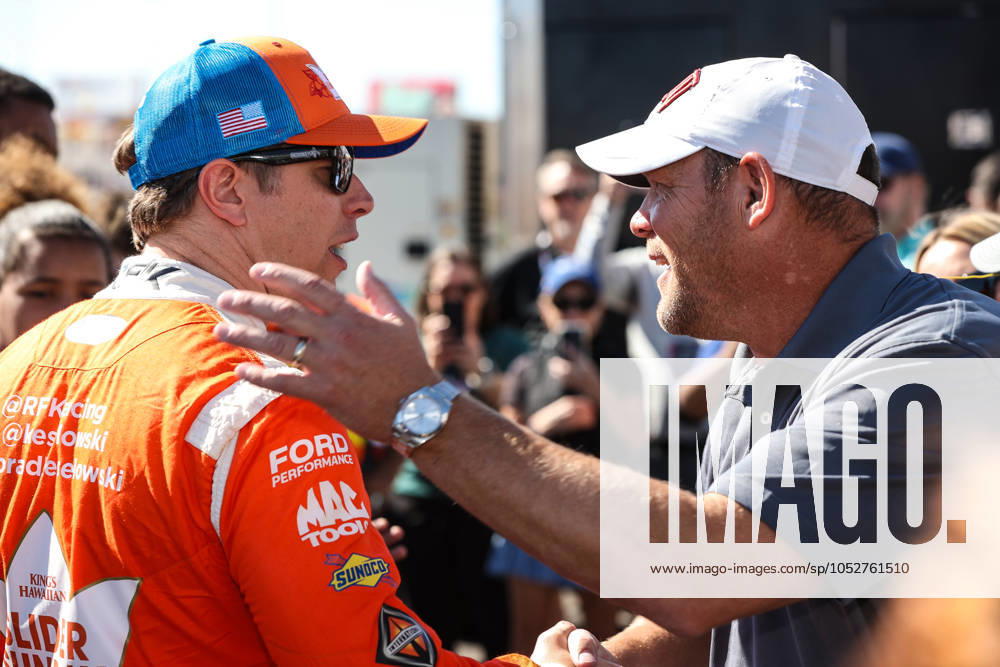 LAS VEGAS, NV - OCTOBER 20: Brad Keselowski ( 6 RFK Racing King s Hawaiian Ford) greets UNLV football coach Barry Odom (R) prior to the start of the South Point 400 NASCAR, Motorsport, USA Cup Series playoff race on October 20, 2024, at Las Vegas Motor Speedway in Las Vegas, NV. (Photo by Christopher Trim Icon Sportswire) AUTO: OCT 20 NASCAR Cup Series South Point 400 Icon241020516