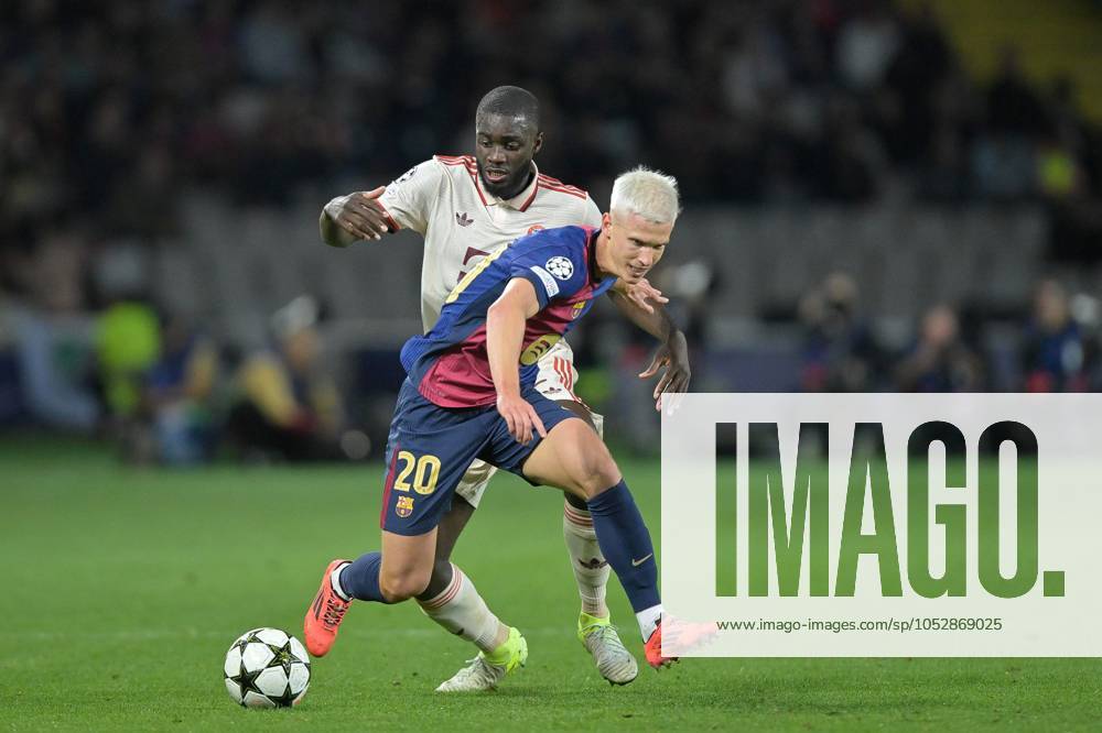 In duel, action, with Dayot Upamecano 2 FC Bayern Muenchen , Dani Olmo 20 FC Barcelona , FC Barcelona vs FC Bayern Muenchen, Champions League, Soccer, Matchday 3, 23 10 2024 Barcelona Catalonia Spain