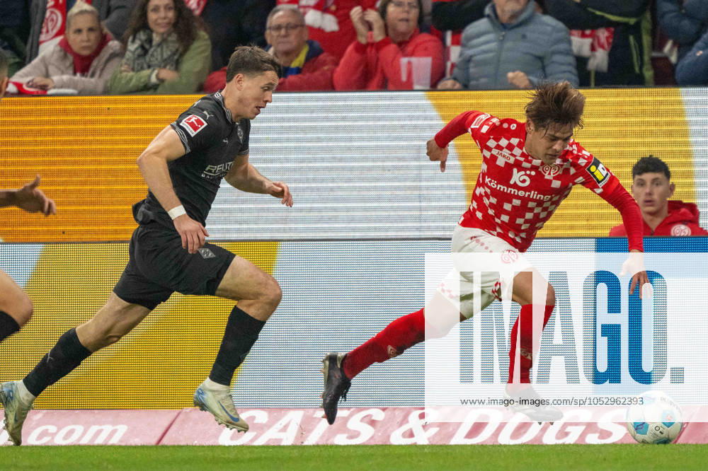 Philipp Sander Borussia Mönchengladbach Kaishu Sano Mainz 05 battle for the ball during the Bundesliga match between 1 FSV Mainz 05 and Borussia Mönchengladbach, Mewa Arena on October 25, 2024 in Mainz, Germany Photo by Wolfgang Denkinger DeFodi Images Philipp Sander Borussia Mönchengladbach Kaishu Sano Mainz 05 battle for the ball during the Bundesliga match between 1 FSV Mainz 05 and Borussia Mönchengladbach at Mewa Arena on October 25, 2024 in Mainz, Germany Photo by Wolfgang Denkinger DeFodi Images not used in POL SRB CRO FRA GBR NED ITA USA Defodi 747 747 20241025 MA05BMG 000000114 Defodi-747 not used in POL SRB CRO FRA GBR NED ITA USA DFL regulations prohibit any use of photographs as image sequences and or quasi-video.