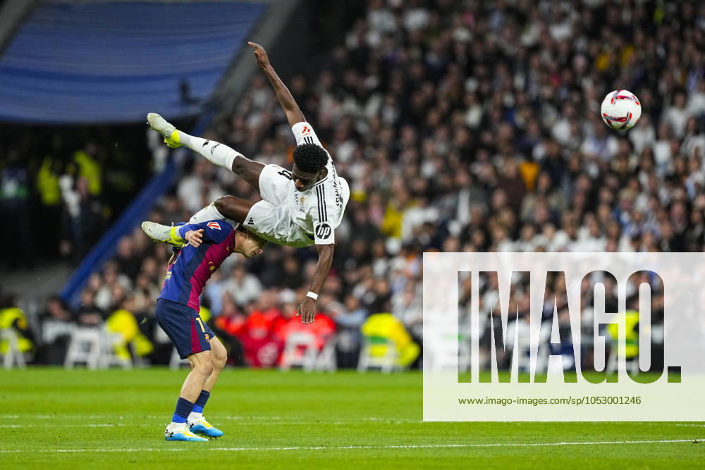 Aurelien Tchouameni of Real Madrid and Marc Casado of FC Barcelona, Barca in action during the Spanish league, La Liga EA Sports, football match played between Real Madrid and FC Barcelona at Santiago Bernabeu stadium on October 26, 2024, in Madrid, Spain. Madrid SPAIN - ZUMAa181 20241026_zaa_a181_221