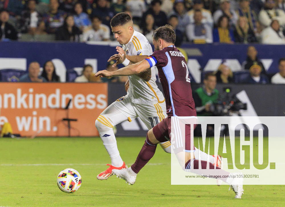 Gabriel Pec 11 of the LA Galaxy is defended by Keegan Rosenberry 2 of the Colorado Rapids during the Audi 2024 MLS, Fussball Herren, USA Cup Playoffs Round One Game 1 of 3 on Saturday October 26, 2024 at Dignity Health Sports Park Stadium in Carson, California. The Galaxy defeats Rapids, 5-0. JAVIER ROJAS PI Los Angeles USA - ZUMAp124 20241026_zaa_p124_056