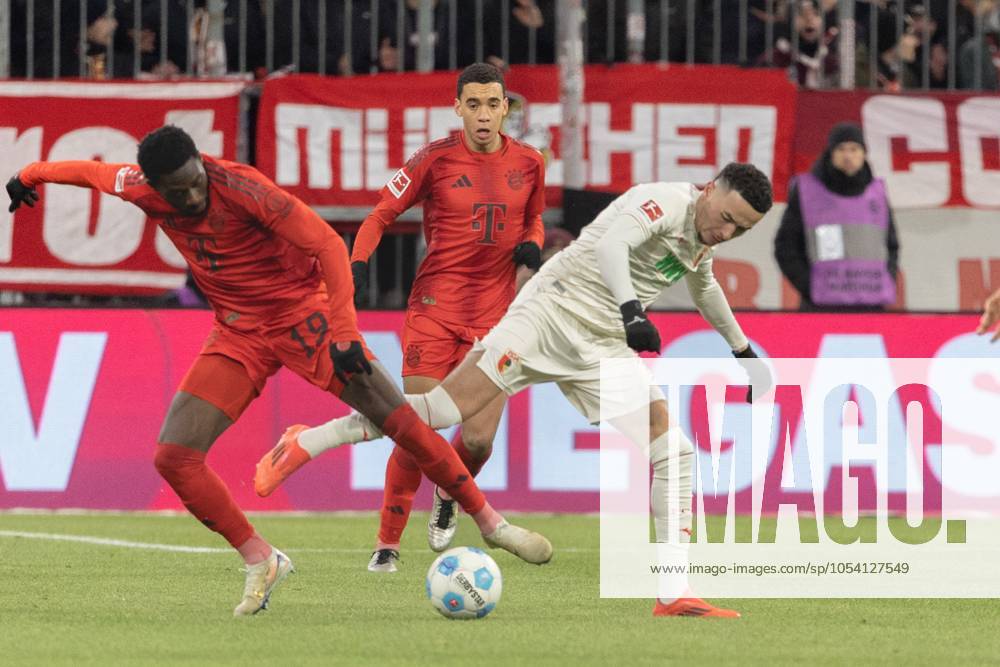 Alphonso Davies FC Bayern Muenchen and Ruben Vargas FC Augsburg v l in a duel, FC Bayern Muenchen vs FC Augsburg, Football, 1 Bundesliga, 11 Matchday, 22 11 2024 DFB regulations prohibit any use of photographs as image sequences and or quasi video Muenchen Bayern Germany