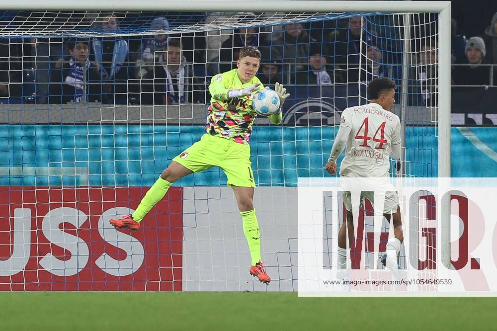 Goalkeeper action by Finn Dahmen 1 FC Augsburg , Karlsruher SC vs FC Augsburg, Soccer, DFB Pokal, Round of 16, 04 12 2024 DFB regulations prohibit any use of photographs as image sequences and or quasi video Karlsruhe Baden Wuerttemberg Germany
