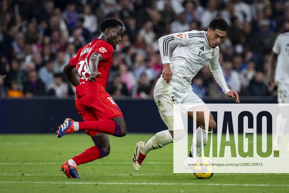 Real Madrid CF vs Sevilla FC - La Liga EA Sports 2024 25 Jude Bellingham of Real Madrid CF (R) in action against Lucien Agoume of Sevilla FC (L) during the La Liga EA Sports 2024 25 football match between Real Madrid CF vs Sevilla FC at Estadio Santiago Bernabeu on December 22, 2024 in Madrid, Spain. Madrid Estadio Santiago Bernabeu Madrid Spain