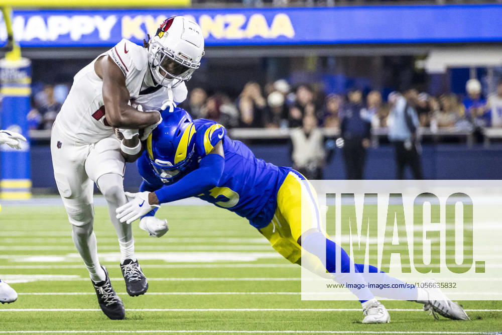NFL, American Football Herren, USA 2024: Los Angeles Rams Vs Arizona Cardinals in Los Angeles - 28 Dec 2024 Los Angeles Rams wide receiver Tyler Johnson (L) escapes a tackle-attempt by Los Angeles Rams safety Kam Curl (R) during an NFL football game at SoFi Stadium. Los Angeles United States