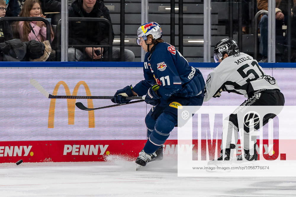 Fight for the puck duel between Markus Eisenschmid EHC Red Bull Muenchen, 11 and Andy Miele Grizzlys Wolfsburg, 51 GER, EHC Red Bull Muenchen vs Grizzlys Wolfsburg, Ice Hockey, DEL, Matchday 32, Season 2024 2025, 30 12 2024 GER, EHC Red Bull Muenchen vs Grizzlys Wolfsburg, Ice Hockey, DEL, Matchday 32, Season 2024 2025, 30 12 2024 Muenchen