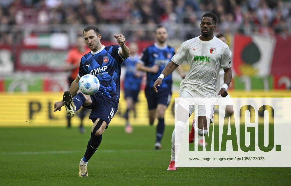 Duel, action Budu Zivzivadze Siwsiwadse 1 FC Heidenheim 1846 FCH 12 vs Samuel Essende FC Augsburg FCA 09 FC Augsburg FCA vs 1 FC Heidenheim FCH 25 01 2025 DFL REGULATIONS PROHIBIT ANY USE OF PHOTOGRAPHS AS IMAGE SEQUENCES AND OR QUASI VIDEO FC Augsburg FCA vs 1 FC Heidenheim FCH