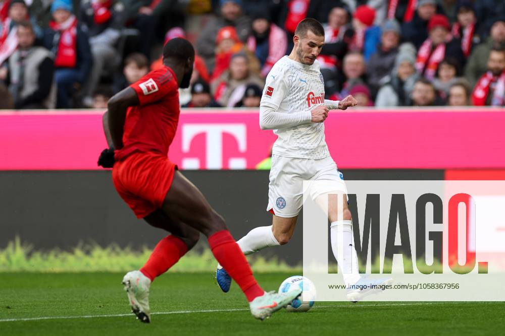 In duel, action, with Dayot Upamecano 2 FC Bayern Muenchen , David Zec 26 Holstein Kiel , FC Bayern Muenchen vs Holstein Kiel, Soccer, 1 Bundesliga, 20 Matchday, 01 02 2025 DFB regulations prohibit any use of photographs as image sequences and or quasi video Muenchen Bayern Germany