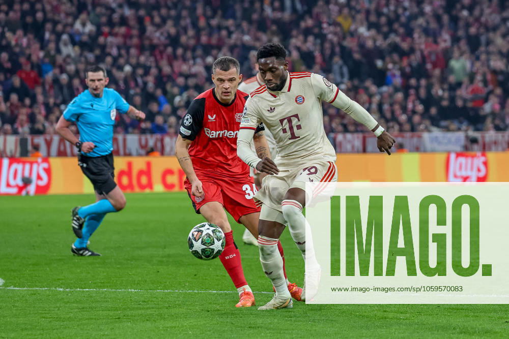 Alphonso Davies FC Bayern Muenchen, 19 with ball with Granit Xhaka Bayer 04 Leverkusen, 34 , GER, FC Bayern Muenchen vs Bayer 04 Leverkusen, Football, UEFA Champions League, Round of 16 first leg, 2024 2025 season, 05 03 2025, GER, FC Bayern Muenchen vs Bayer 04 Leverkusen, Football, UEFA Champions League, Round of 16 first leg, 2024 2025 season, 05 03 2025 Muenchen