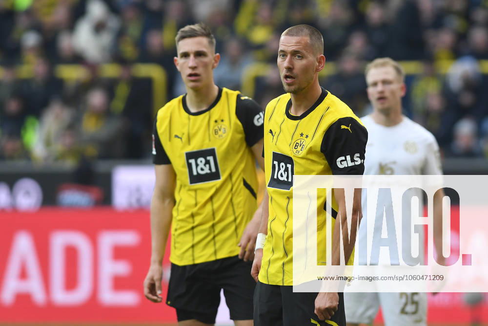 Nico Schlotterbeck Borussia Dortmund and Waldemar Anton Borussia Dortmund look on during the Bundesliga match between Borussia Dortmund and 1 FSV Mainz 05, SIGNAL IDUNA PARK on March 30, 2025 in Dortmund, Germany, Germany Photo by Ralf Treese DeFodi Images Nico Schlotterbeck Borussia Dortmund and Waldemar Anton Borussia Dortmund look on during the Bundesliga match between Borussia Dortmund and 1 FSV Mainz 05 at Signal Iduna Park on March 30, 2025 in Dortmund, Germany Photo by Ralf Treese DeFodi Images DFL regulations prohibit any use of photographs as image sequences and or quasi video Photo by Ralf Treese DeFodi Images