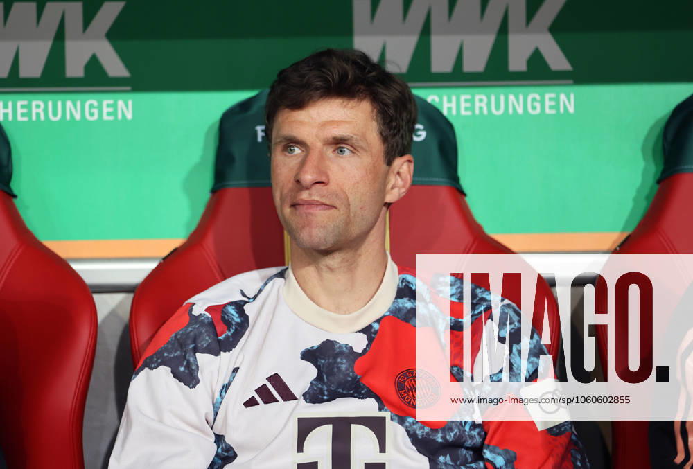 Football, Men, Season 2024 2025, FC Augsburg FC Bayern Munich, Bundesliga, WWK Arena Thomas Müller, Mueller FC Bayern Munich sitting on the substitutes bench DFL DFB regulations prohibit any use of photographs as image sequences and or quasi video
