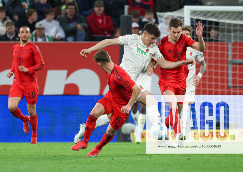 Mert Kömür FC Augsburg 36 prevails against Joshua Kimmich FC Bayern München and Josip Stanisic FC Bayern München FC Augsburg vs SC Freiburg, 28 Matchday DFL REGULATIONS PROHIBIT ANY USE OF PHOTOGRAPHS AS IMAGE SEQUENCES AND OR QUASI VIDEO