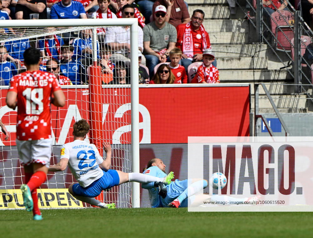 Soccer Bundesliga Season 2024 2025 Mewa Arena Mainz 05 04 2025 1 FSV Mainz 05 mz Holstein Kiel ki Goalkeeper Robin ZENTNER 1 FSV Mainz 05 , re, saves from Lasse ROSENBOOM Holstein Kiel DFL REGULATIONS PROHIBIT ANY USE OF PHOTOGRAPHS AS IMAGE SEQUENCES AND OR QUASI VIDEO NATIONAL AND INTERNATIONAL NEWS AGENCIES OUT Soccer Bundesliga 1 FSV Mainz 05