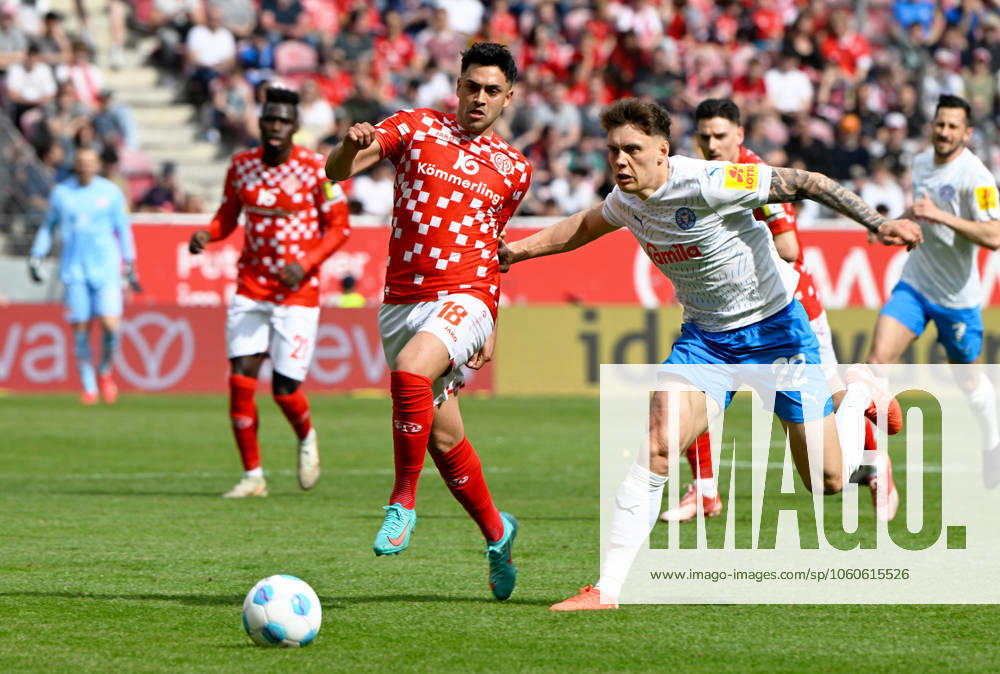 Soccer Bundesliga Season 2024 2025 Mewa Arena Mainz 05 04 2025 1 FSV Mainz 05 mz Holstein Kiel ki Nadiem AMIRI 1 FSV Mainz 05 , li Nicolai REMBERG Holstein Kiel DFL REGULATIONS PROHIBIT ANY USE OF PHOTOGRAPHS AS IMAGE SEQUENCES AND OR QUASI VIDEO NATIONAL AND INTERNATIONAL NEWS AGENCIES OUT Soccer Bundesliga 1 FSV Mainz 05