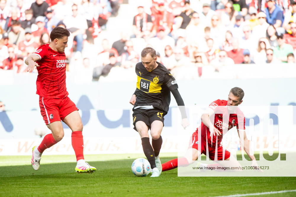 Maximilian Beier Borussia Dortmund, 14 in duel with Matthias Ginter SC Freiburg, 28 , GER, SC Freiburg SCF vs Borussia Dortmund BVB , Soccer Bundesliga, 28 Matchday, Season 2024 2025, 05 04 2025 DFB DFL regulations prohibit any use of photographs as image sequences and or quasi video GER, SC Freiburg SCF vs Borussia Dortmund BVB , Soccer Bundesliga, 28 Matchday, Season 2024 2025, 05 04 2025 Freiburg