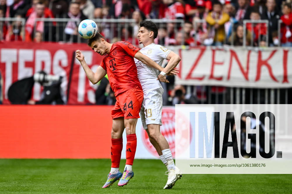 Josip Stanisic FC Bayern Muenchen and Anthony Caci 1 FSV Mainz 05 in a duel during the Bundesliga match between FC Bayern München and 1 FSV Mainz 05, Allianz Arena on April 26, 2025 in Munich, Germany Photo by Harry Langer DeFodi Images Josip Stanisic FC Bayern Muenchen and Anthony Caci 1 FSV Mainz 05 battle for the ball during the Bundesliga match between FC Bayern München and 1 FSV Mainz 05 at Allianz Arena on April 26, 2025 in Munich, Germany Photo by Harry Langer DeFodi Images DFL regulations prohibit any use of photographs as image sequences and or quasi video Photo by Harry Langer DeFodi Images DFL regulations prohibit any use of photographs as image sequences and or quasi video