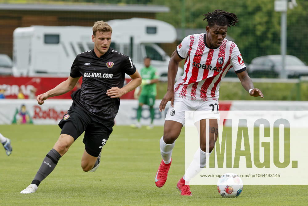 Christoph Daferner SG Dynamo Dresden, 33 and Cyriaque Irie SC Freiburg, 22 in a running duel , Football, Test match, 2025 2026, SC Freiburg vs SG Dynamo Dresden, 25 07 2025, Football ground Schruns, Schruns, Austria Schruns Football ground Schruns Vorarlberg Austria