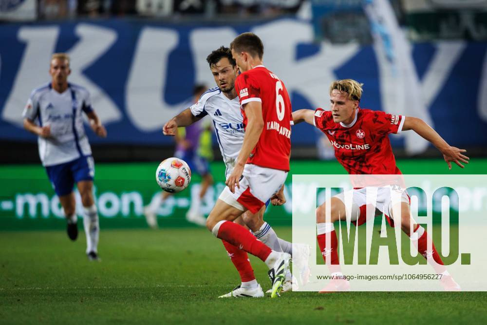 Adrian Gantenbein FC Schalke 04 in duel with Mika Haas 1 FC Kaiserslautern and Fabian Kunze 1 FC Kaiserslautern , 1 FC Kaiserslautern vs FC Schalke 05, Soccer, 2 Bundesliga, Matchday 2, Season 2025 2026, 09 08 2025 1 FC Kaiserslautern vs FC Schalke 05, Soccer, 2 Bundesliga, Matchday 2, Season 2025 2026