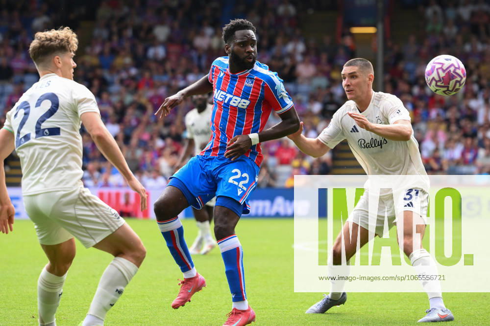 Crystal Palace v Nottingham Forest - Premier League Odsonne Edouard of Crystal Palace heads the ball under pressure from Nikola Milenkovic and Ryan Yates of Nottingham Forest during the Premier League match between Crystal Palace and Nottingham Forest at Selhurst Park in London, England, on August 24, 2025. London Greater London United Kingdom
