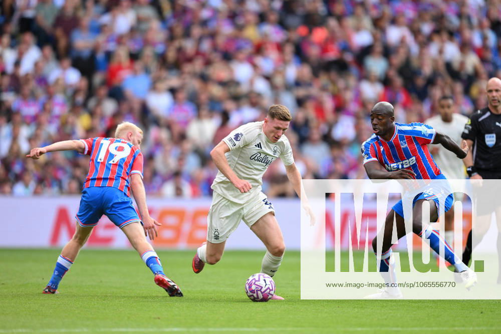 Crystal Palace v Nottingham Forest - Premier League Elliott Anderson of Nottingham Forest is under pressure from Jean-Philippe Mateta and Will Hughes of Crystal Palace during the Premier League match between Crystal Palace and Nottingham Forest at Selhurst Park in London, England, on August 24, 2025. London Greater London United Kingdom