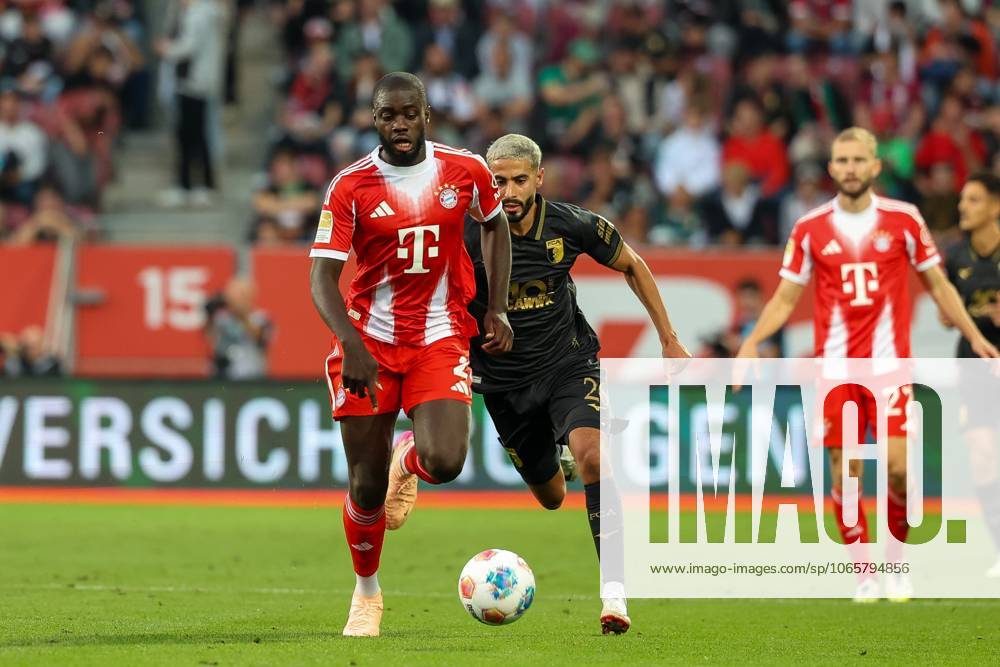 In duel, action, with Dayot Upamecano 2 FC Bayern Muenchen , Elias Saad 26 FC Augsburg , FC Augsburg vs FC Bayern Muenchen, Soccer, 1 Bundesliga, 2 Matchday, 30 08 2025 DFB regulations prohibit any use of photographs as image sequences and or quasi video Augsburg Bayern Germany
