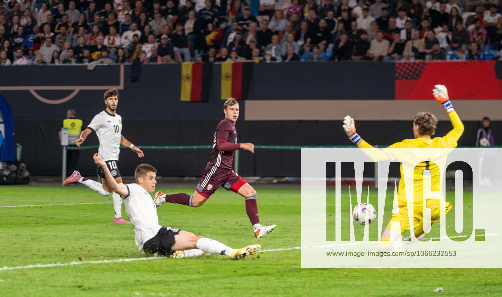 Soccer, Youth, Season 2025 26, U21, European Championship Qualification Group F 3 Matchday in Rostock, Germany Latvia, f l Nicolo Tresoldi U21, Germany scores the goal for 2 0 against goalkeeper Nikita Parfjonovs, 09 09 2025,