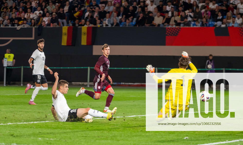 Soccer, Youth, Season 2025 26, U21, European Championship Qualification Group F 3 Matchday in Rostock, Germany Latvia, f l Nicolo Tresoldi U21, Germany scores the goal for 2 0 against goalkeeper Nikita Parfjonovs, 09 09 2025,
