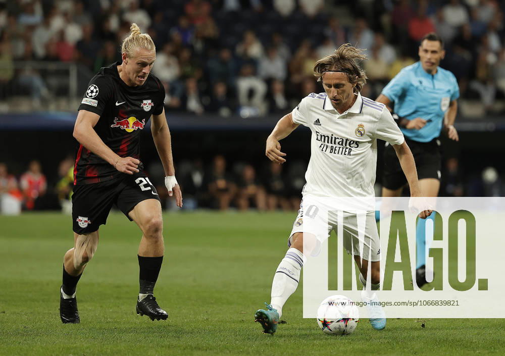 Real Madrid v RB Leipzig - UEFA Champions League MADRID, SPAIN - SEPTEMBER 14: Luka Modric (R) of Real Madrid in action against Xaver Schlager (L) of RB Leipzig during the UEFA Champions League Group F soccer match between Real Madrid and RB Leipzig at Santiago Bernabeu stadium in Madrid, Spain on 14 September 2022. Madrid Spain. Editorial use only. Please get in touch for any other usage.