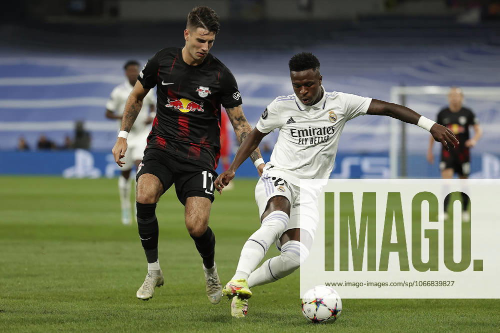 Real Madrid v RB Leipzig - UEFA Champions League MADRID, SPAIN - SEPTEMBER 14: Vinicius Junior (R) of Real Madrid in action against Dominik Szoboszlai (L) of RB Leipzig during the UEFA Champions League Group F soccer match between Real Madrid and RB Leipzig at Santiago Bernabeu stadium in Madrid, Spain on 14 September 2022. Madrid Spain. Editorial use only. Please get in touch for any other usage.